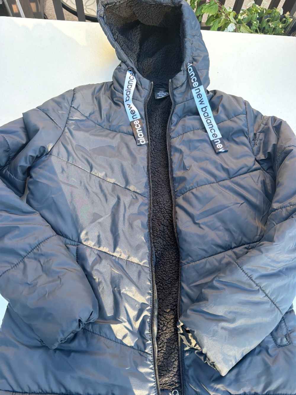 Balance Women's Hooded Tech Puffer Jacket, featuring a cozy black sherpa-fleece